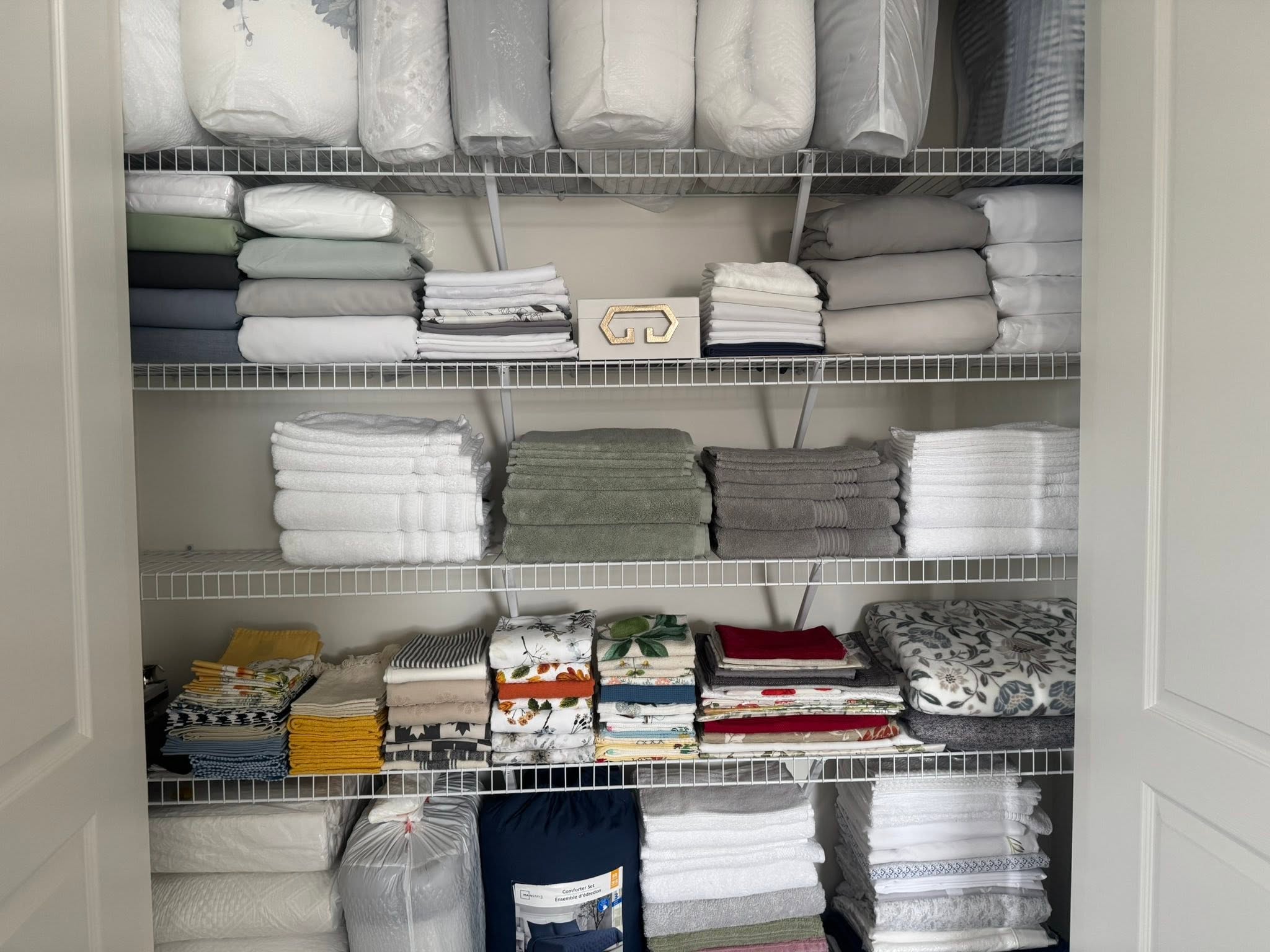Professionally organized linen closet — home organization service in York Region